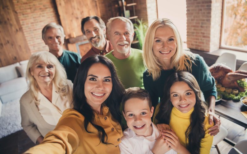 Closeup portrait photo of full family gathering eight people cuddle, embrace hold hands finish dinner make shoot selfie memorable lovely picture generation in home evening living room indoors